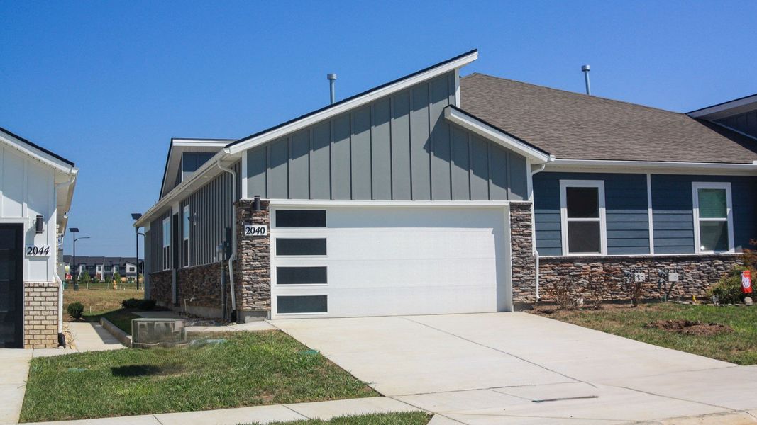 Front exterior of a new home in Nexus South, Gallatin, TN, highlighting curb appeal (Image 1). Front exterior of a new home in Nexus South, Gallatin, TN, highlighting curb appeal (Image 1).