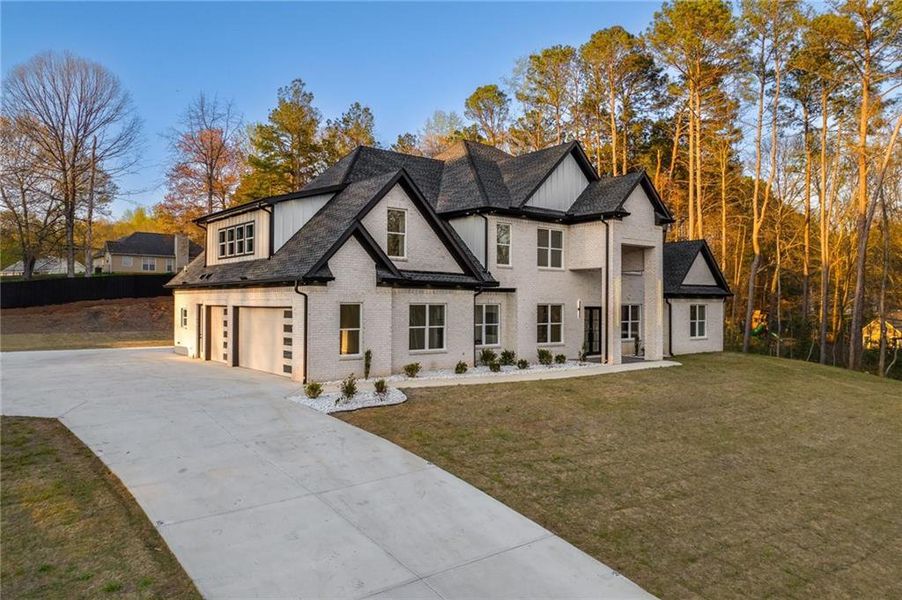 Front exterior of a new home in , Loganville, GA, highlighting curb appeal (Image 29).