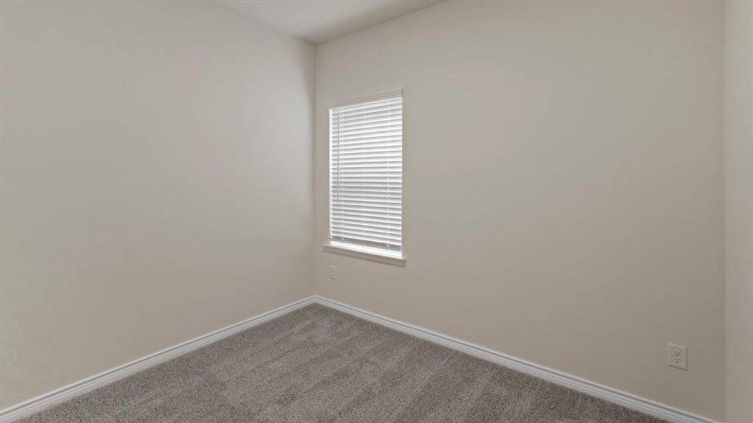 Unfurnished room with baseboards and carpet flooring Unfurnished room with baseboards and carpet flooring