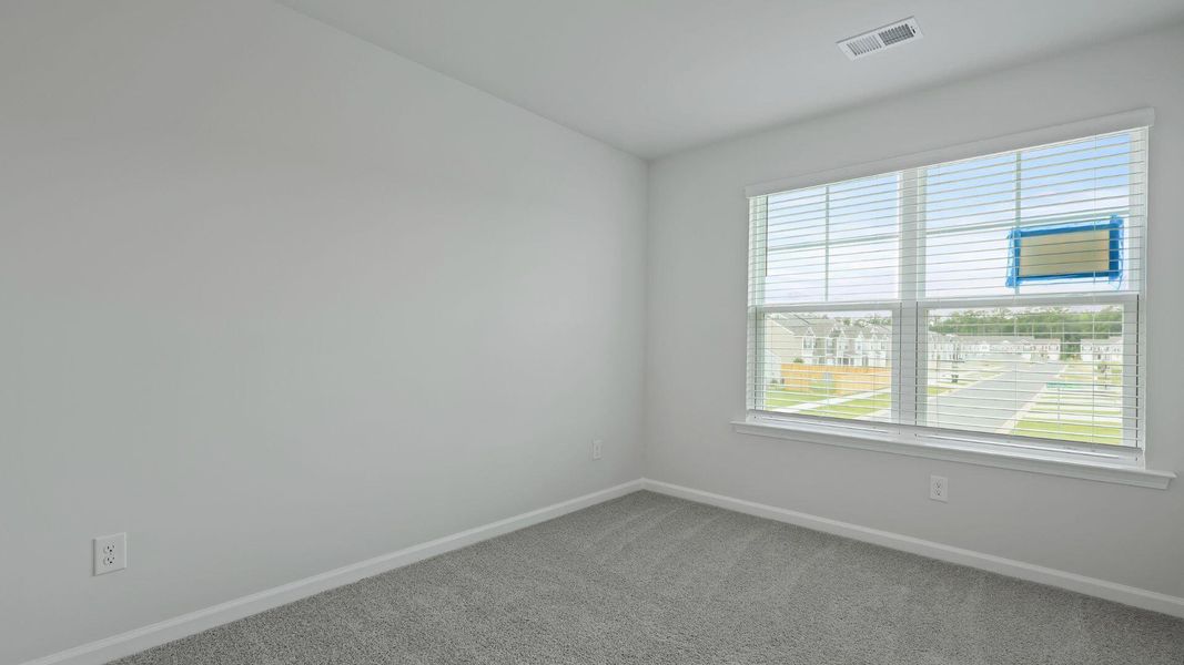 Spacious, unfurnished interior of a new home in Pine Hills Townhomes at Cane Bay, Summerville (Image 18).