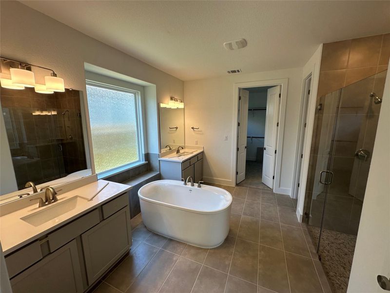 Primary Bath retreat with dual vanities, soaking tub & walk-in shower