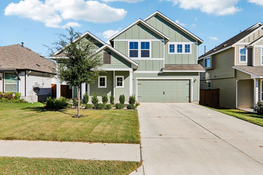 Front exterior of a new home in Orchard Ridge, Liberty Hill, TX, highlighting curb appeal (Image 1).