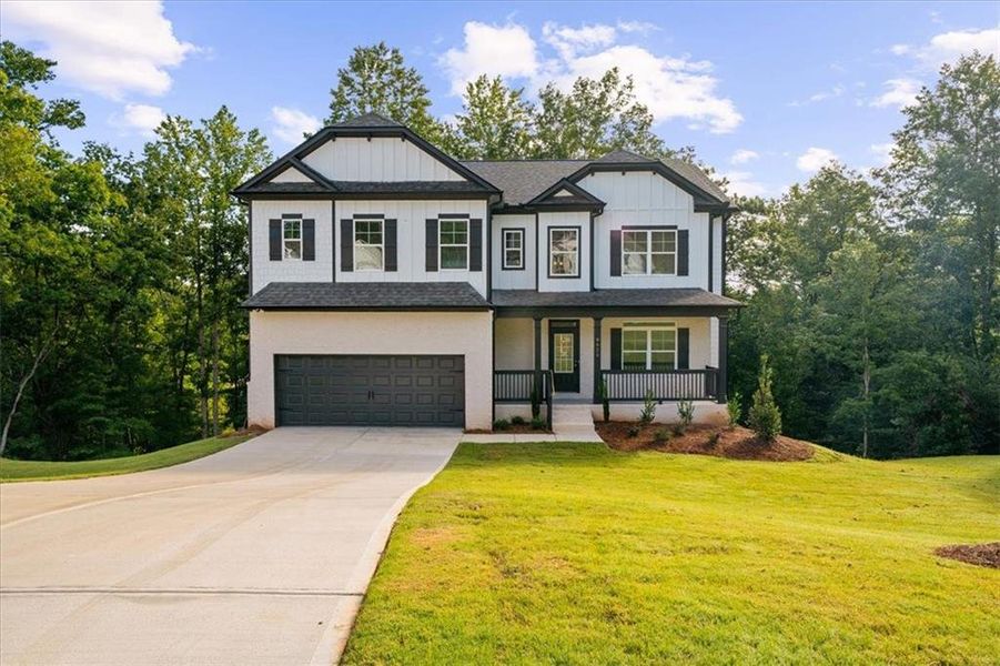 Front exterior of a new home in River Rock, Ball Ground, GA, highlighting curb appeal (Image 25).