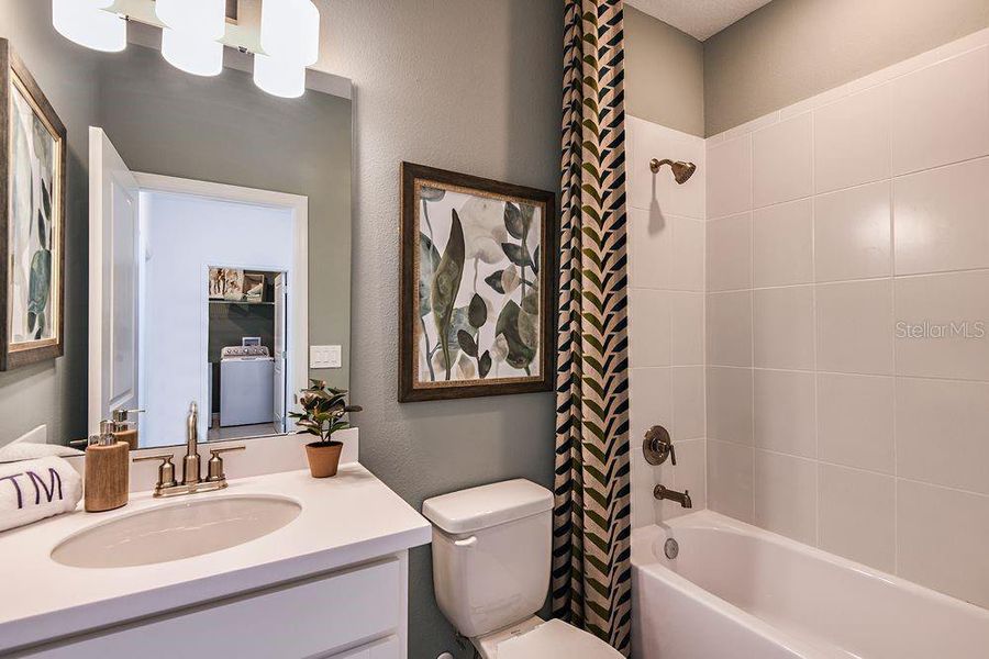 Furnished interior view inside a new home in Harvest at Ovation, Winter Garden (Image 28).