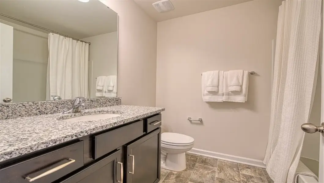 Furnished interior view inside a new home in Townes at Tap Root Farms, Fletcher (Image 25). Furnished interior view inside a new home in Townes at Tap Root Farms, Fletcher (Image 25).