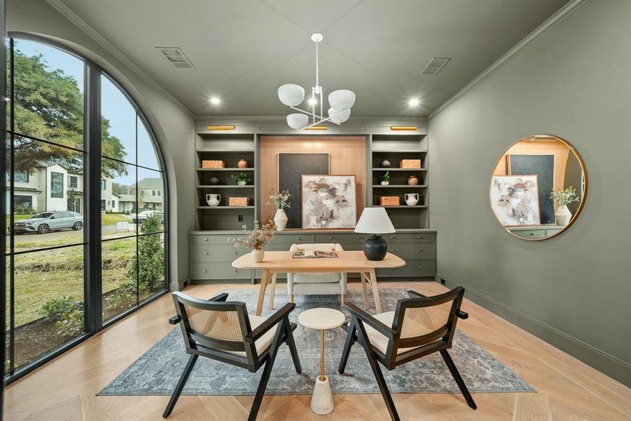 Office space featuring built in shelves, crown molding, wood finished floors, a chandelier, and recessed lighting Office space featuring built in shelves, crown molding, wood finished floors, a chandelier, and recessed lighting