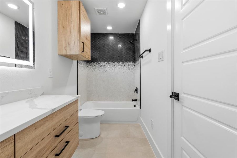 Full bath with toilet, visible vents, recessed lighting, shower / bath combination, and vanity