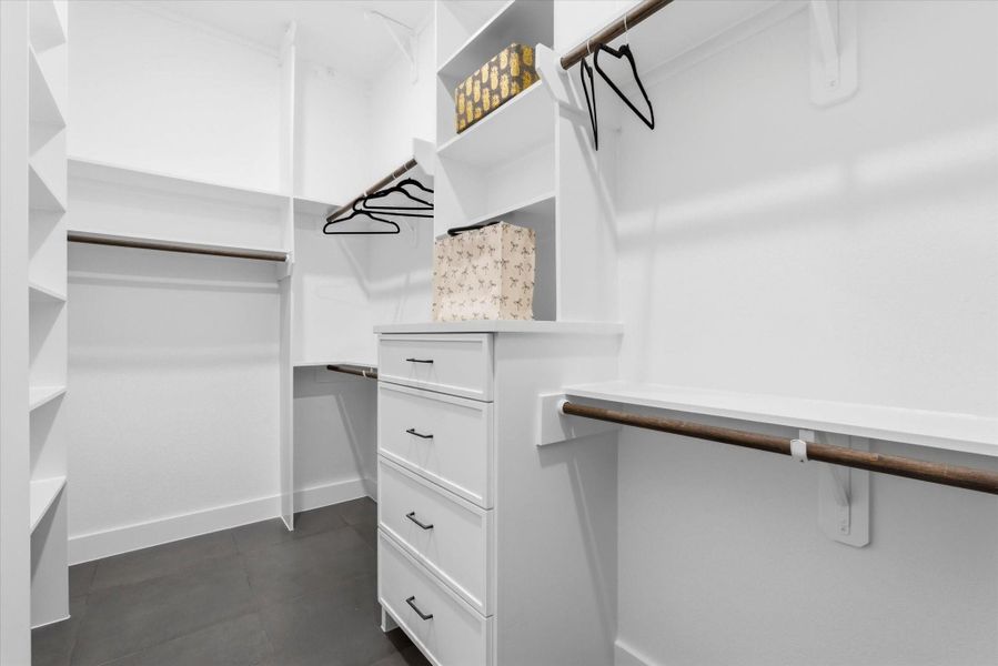 Thoughtfully designed walk-in closet within the primary suite provides abundant storage and everyday convenience.
