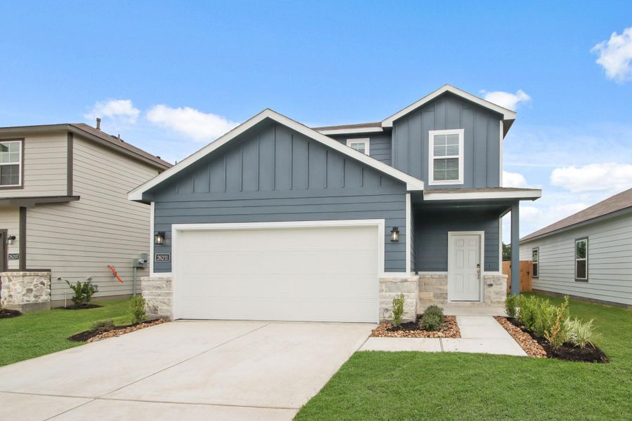 Front exterior of a new home in Northpark South, Porter, TX, highlighting curb appeal (Image 14). Front exterior of a new home in Northpark South, Porter, TX, highlighting curb appeal (Image 14).