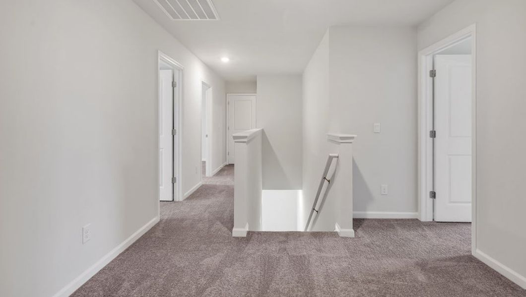 Representative unfurnished interior of a home built from the GLYNN by D.R. Horton in Grayson Park, Leland (Image 23).