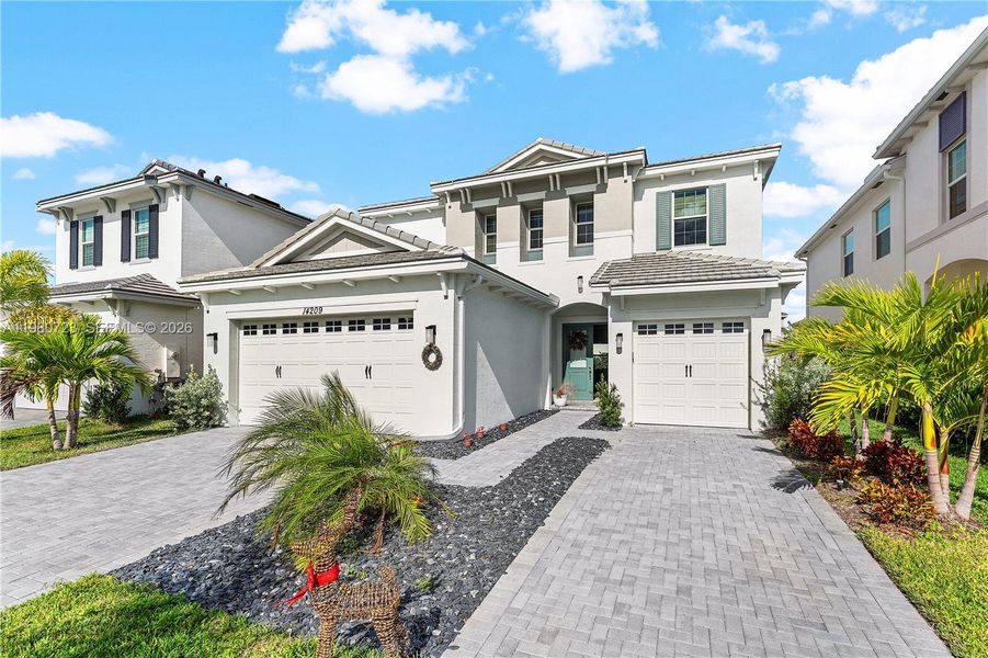 Front exterior of a new home in , Westlake, FL, highlighting curb appeal (Image 26).