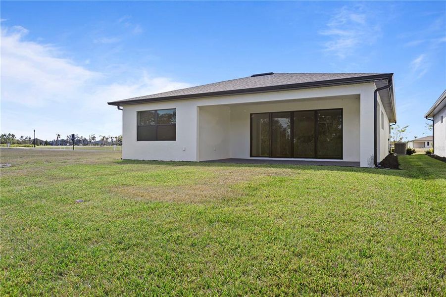 Exterior details and patio area of a home in Woodland Preserve, Parrish (Image 22).