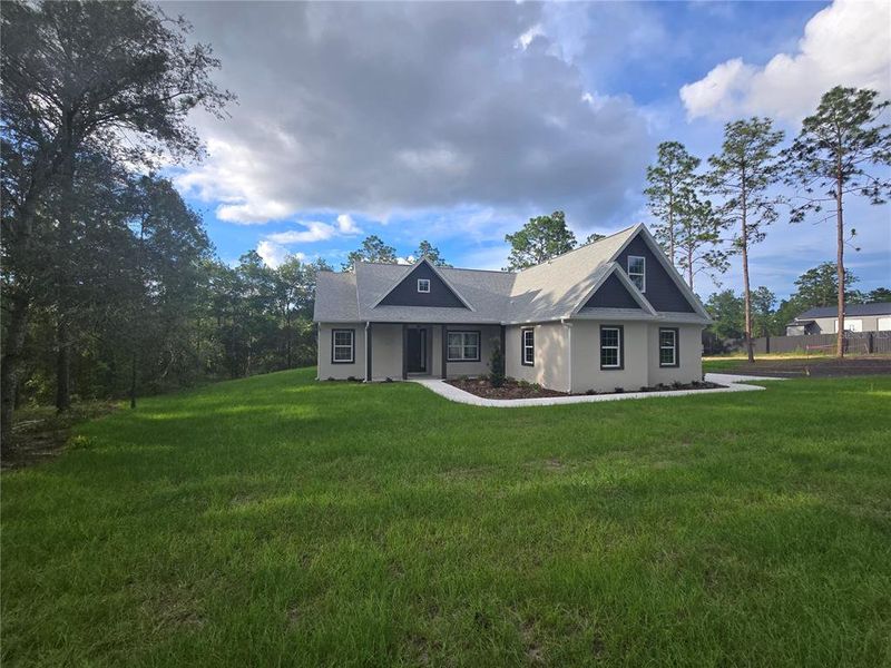 Front exterior of a new home in , Weeki Wachee, FL, highlighting curb appeal (Image 1). Front exterior of a new home in , Weeki Wachee, FL, highlighting curb appeal (Image 1).