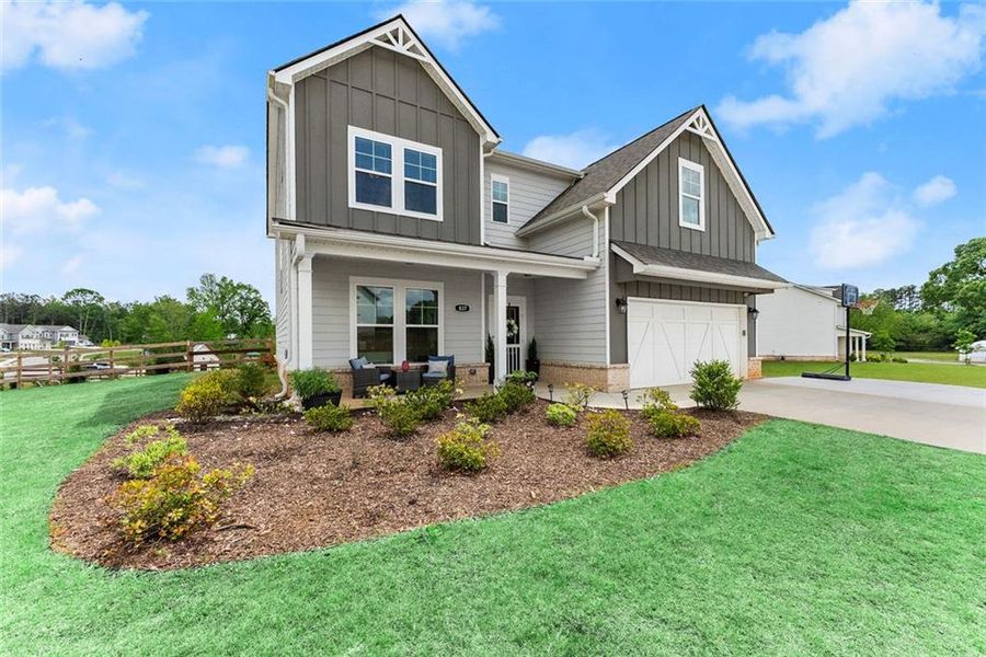 Front exterior of a new home in , Dacula, GA, highlighting curb appeal (Image 1).