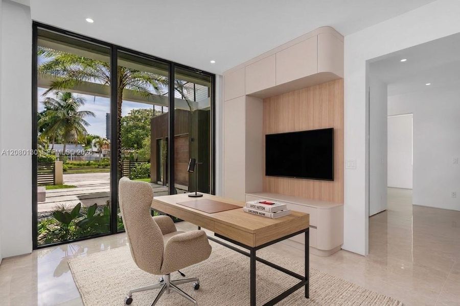 Bedroom/Office. Disclaimer: Several photographs presented in this listing contain digitally added furniture, artwork, and decor. These virtually staged images are intended solely for illustrative purposes.