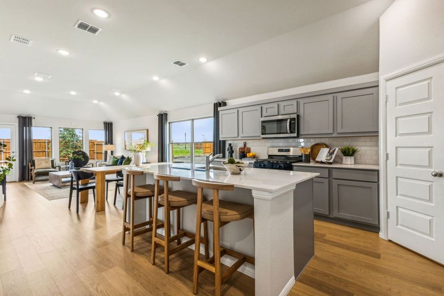 Kitchen in the Turquoise home plan by Trophy Signature Homes – REPRESENTATIVE PHOTO