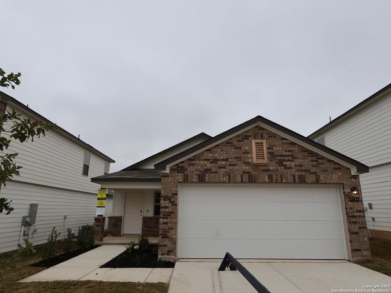Front exterior of a new home in Paloma Park, Converse, TX, highlighting curb appeal (Image 18).