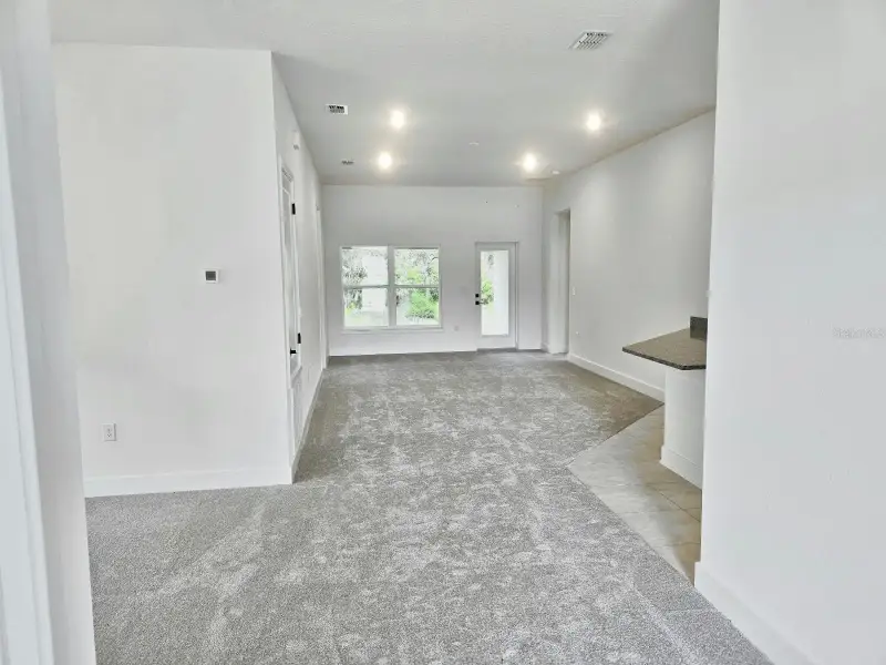 Spacious, unfurnished interior of a new home in Harmony Central, St. Cloud (Image 11).