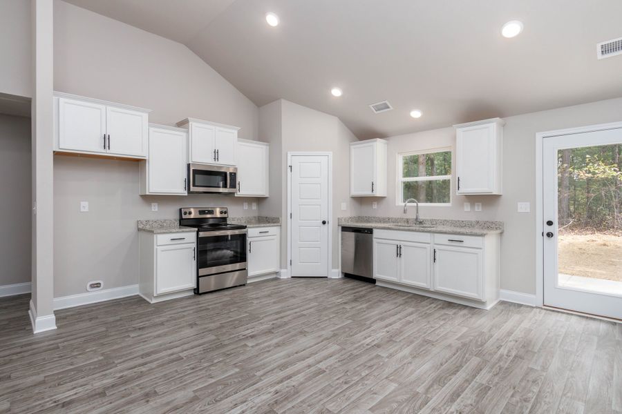 Furnished interior in a model home at Tinnell Station in Waverly (Image 5).