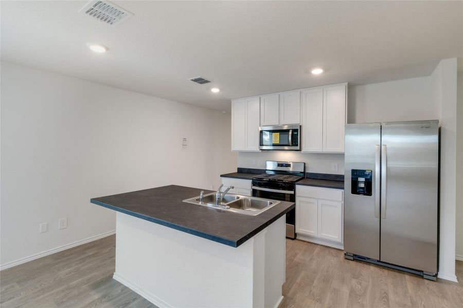 Furnished interior view inside a new home in Watermill, Uhland (Image 9).