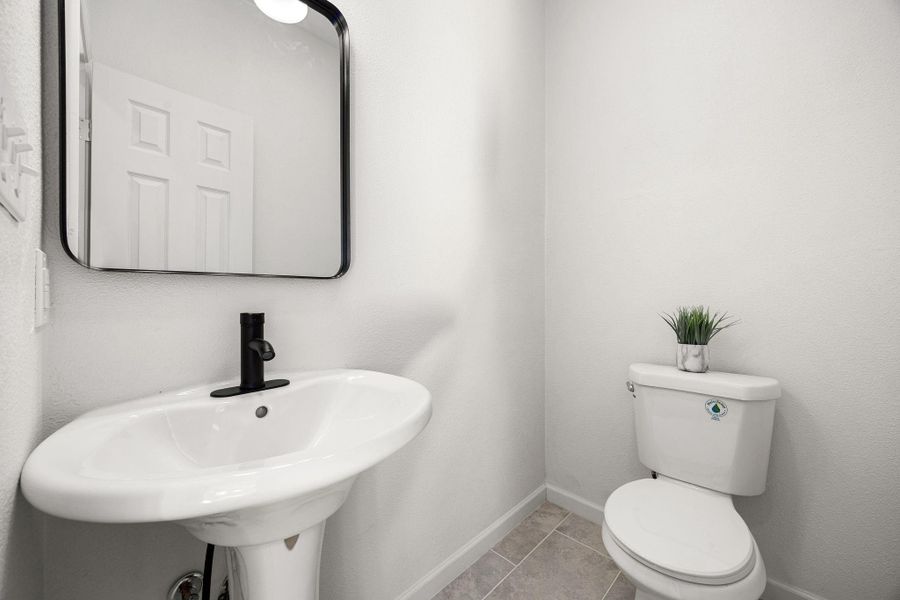 Chic and functional half bath, perfect for guests. Chic and functional half bath, perfect for guests.