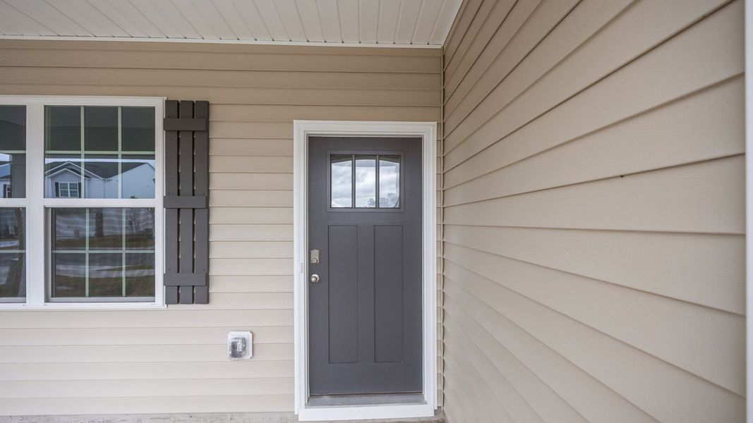 Exterior details and patio area of a home in Ridgewood Farms, Winterville (Image 3).