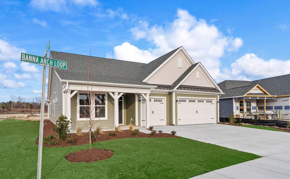 Front exterior of a new home in Traditions at Carolina Forest, Myrtle Beach, SC, highlighting curb appeal (Image 14). Front exterior of a new home in Traditions at Carolina Forest, Myrtle Beach, SC, highlighting curb appeal (Image 14).