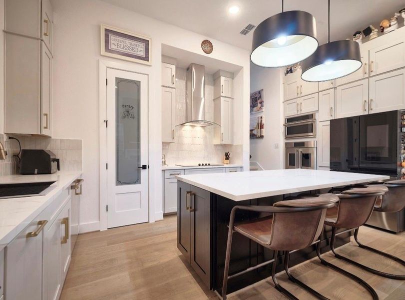 Porcelain counter tops, Monogram appliances & oversized island.