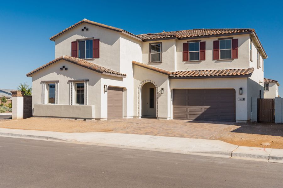 Front exterior of a new home in Waterston Central, Gilbert, AZ, highlighting curb appeal (Image 1). Front exterior of a new home in Waterston Central, Gilbert, AZ, highlighting curb appeal (Image 1).