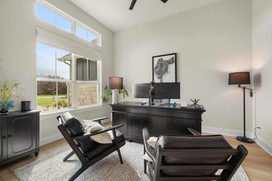 Front office or sitting room filled with natural light and peaceful views.