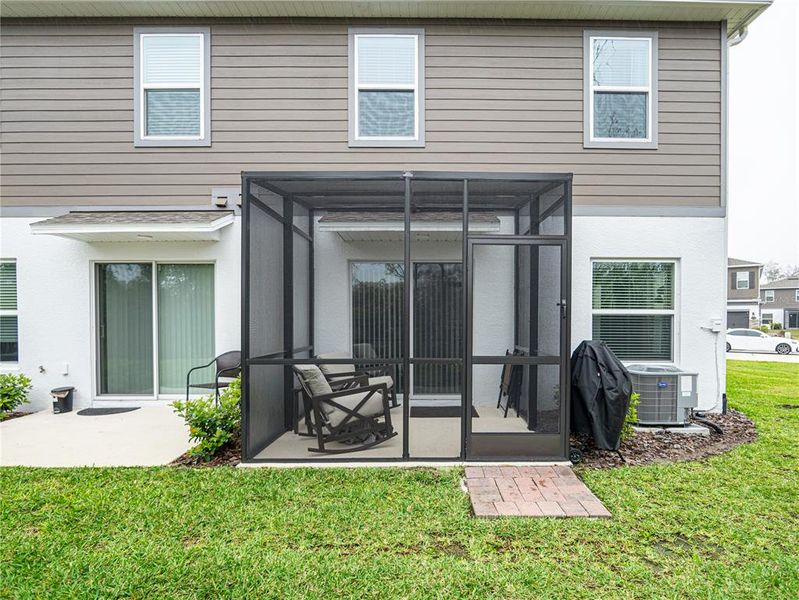 Exterior details and patio area of a home in Towns at Tuskawilla Commons, Oviedo (Image 25).
