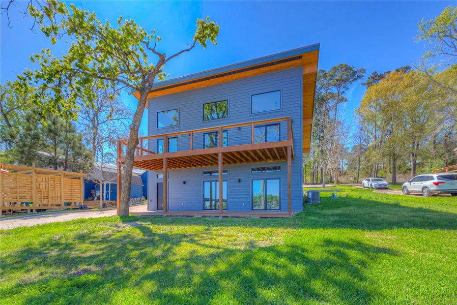 BACK VIEW OF THIS BEAUTIFUL HOME- LOTS OF WIDOWS BOTH DECKS ARE 10 X 32