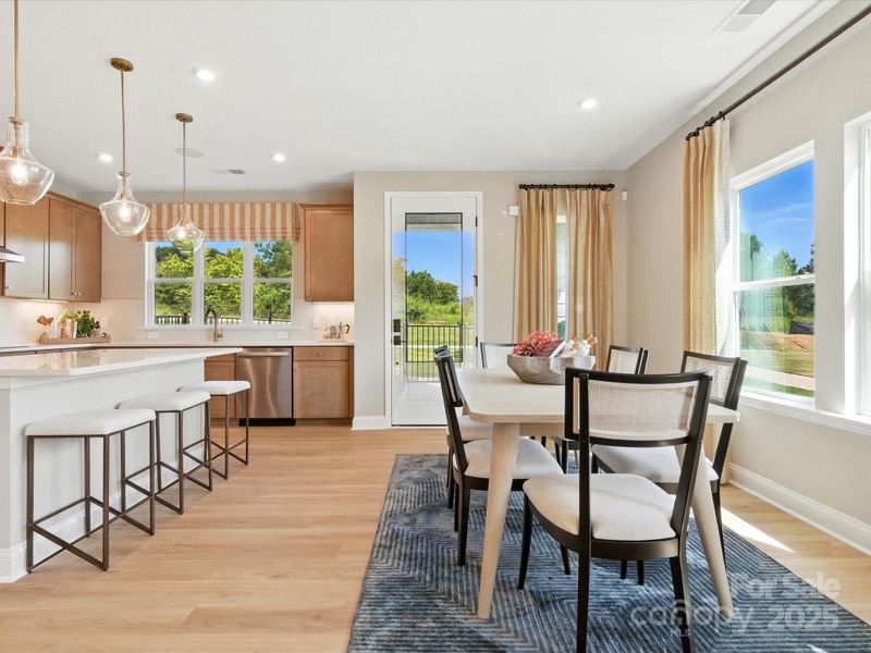 Natural flow from the kitchen to the dining space. *Model Photos | Orientation and structural selections may vary. Natural flow from the kitchen to the dining space. *Model Photos | Orientation and structural selections may vary.