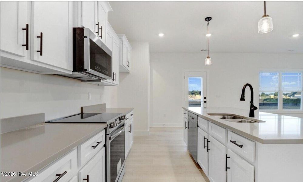 Furnished interior view inside a new home in Wood Creek Landing, Leland (Image 4).