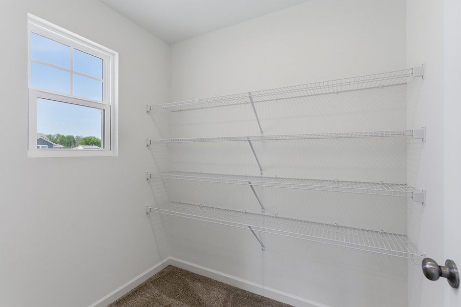 A white wall with a window. A white wall with a window.