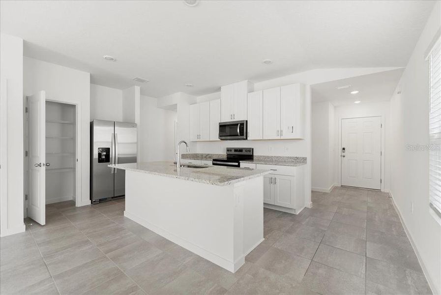 Furnished interior view inside a new home in Flagler Village - Classic Series, Palm Coast (Image 10). Furnished interior view inside a new home in Flagler Village - Classic Series, Palm Coast (Image 10).