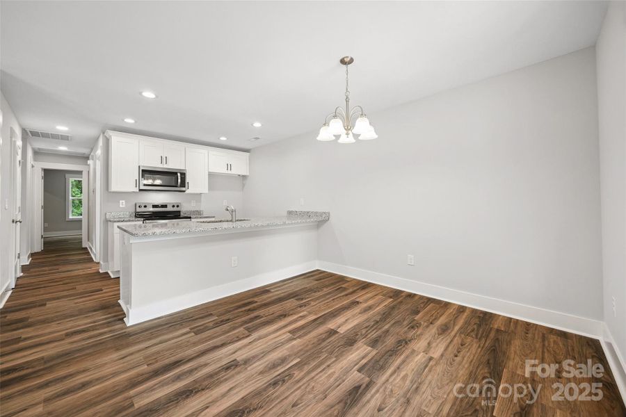 Open concept floorplan with the kitchen & dining area to the right side