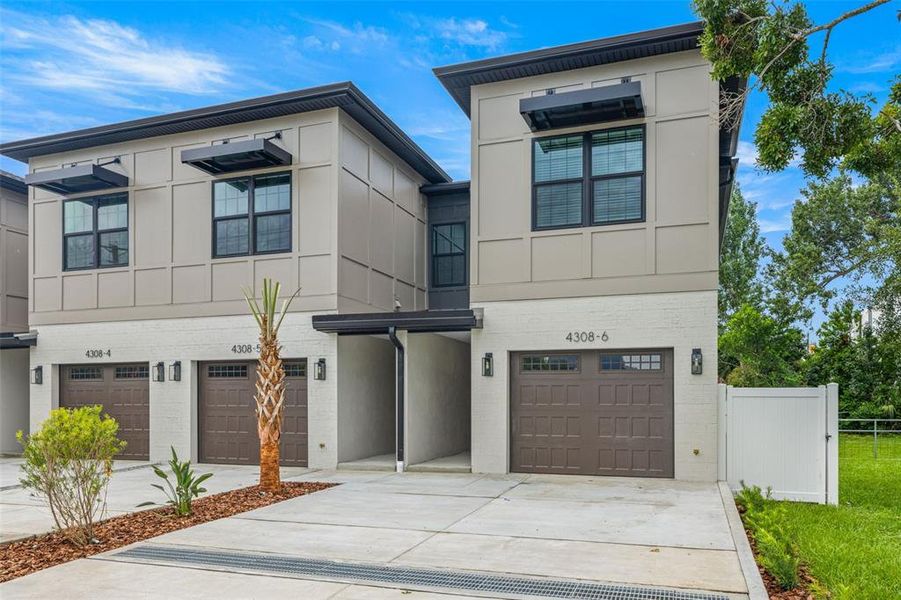 Front exterior of a new home in , Tampa, FL, highlighting curb appeal (Image 26). Front exterior of a new home in , Tampa, FL, highlighting curb appeal (Image 26).