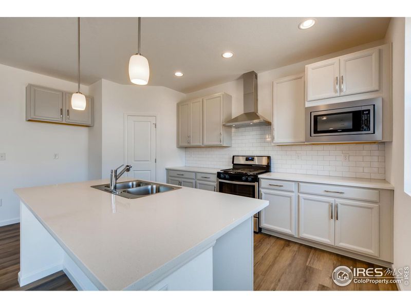 Photo not of actual home - Home will have the gourmet Kitchen w/double ovens