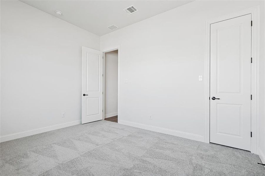 Empty room with light carpet