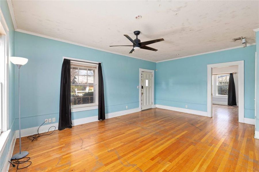 Living room with a view of a bedroom through the door to the right. Living room with a view of a bedroom through the door to the right.