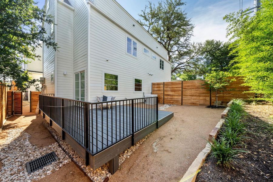 Private back yard with large deck.