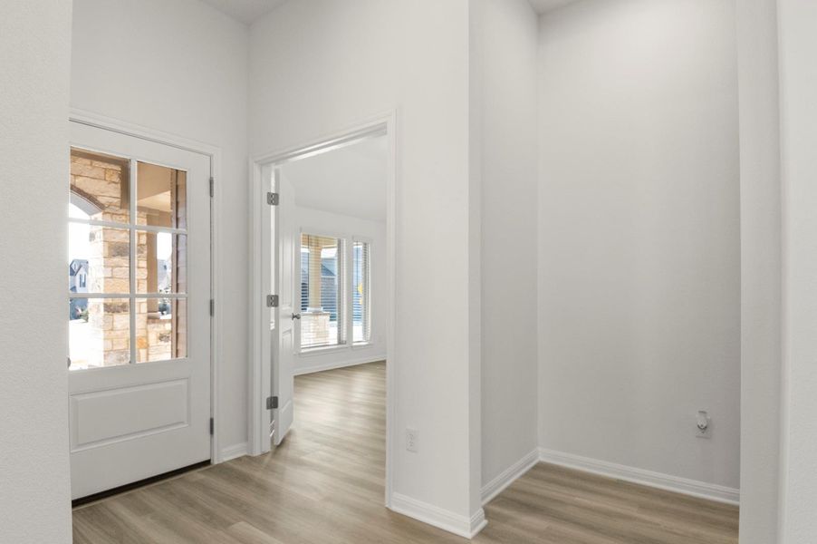 Entryway featuring light wood finished floors and baseboards