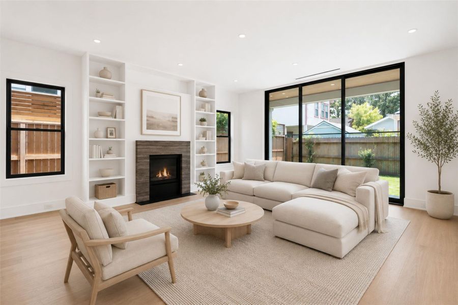 Grand family room anchored by fireplace with stone surrounded and oversized steel doors opening to nicely sized green space. *Virtually staged.