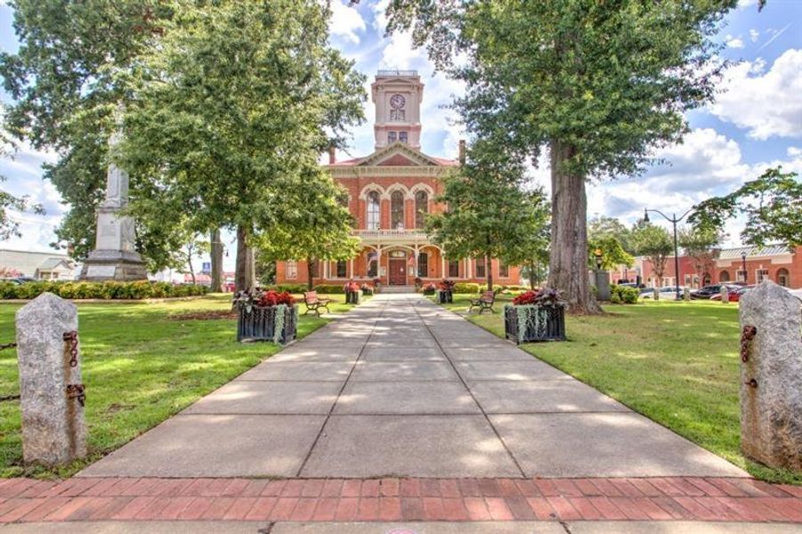 Front exterior of a new home in Pinegate, Covington, GA, highlighting curb appeal (Image 27).