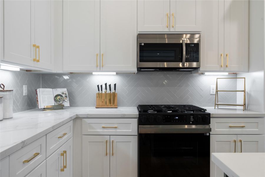 Designed to feel as good as it looks. From the rosemary green island to the soft glow of under mount lighting, every detail, from brass accents to soft close cabinetry, was selected with intention. Designed to feel as good as it looks. From the rosemary green island to the soft glow of under mount lighting, every detail, from brass accents to soft close cabinetry, was selected with intention.