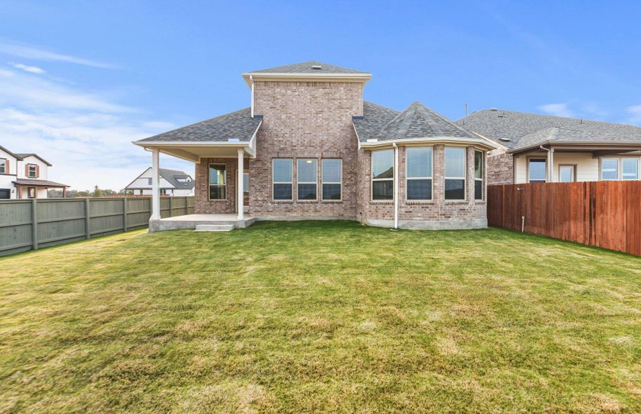 Exterior details and patio area of a home in Saddleback at Santa Rita Ranch, Liberty Hill (Image 20).