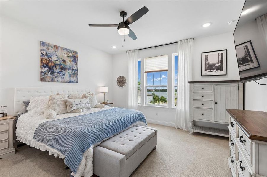 Wake up to tranquil lake views and abundant natural light in a spacious owner’s retreat designed for comfort, relaxation, and everyday escape.