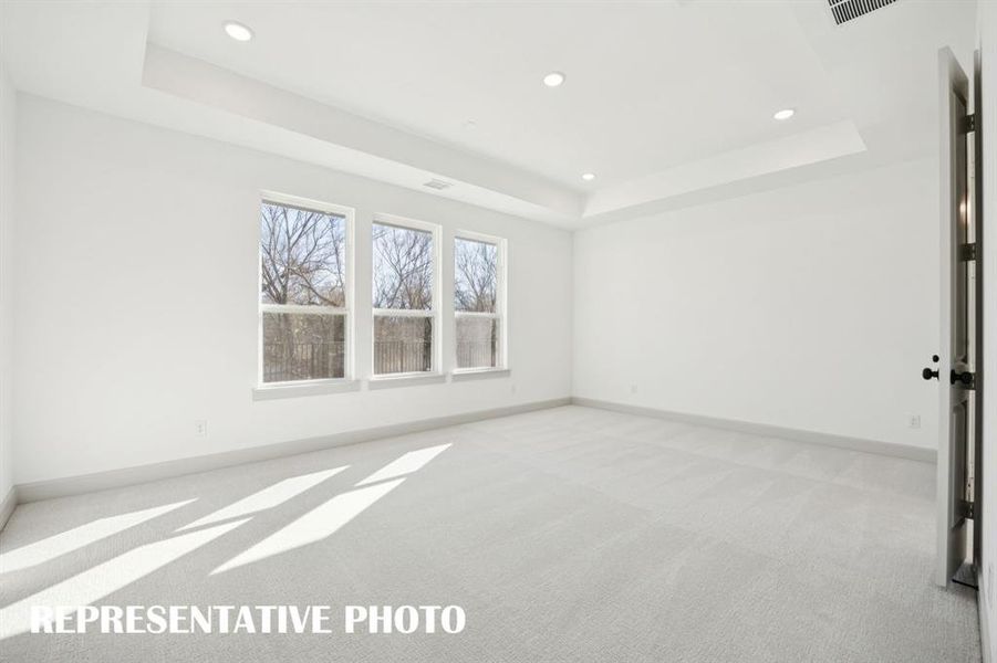 Located at the rear of the home for additional privacy, this dreamy owner's suite was designed for rest and relaxation!  REPRESENTATIVE PHOTO