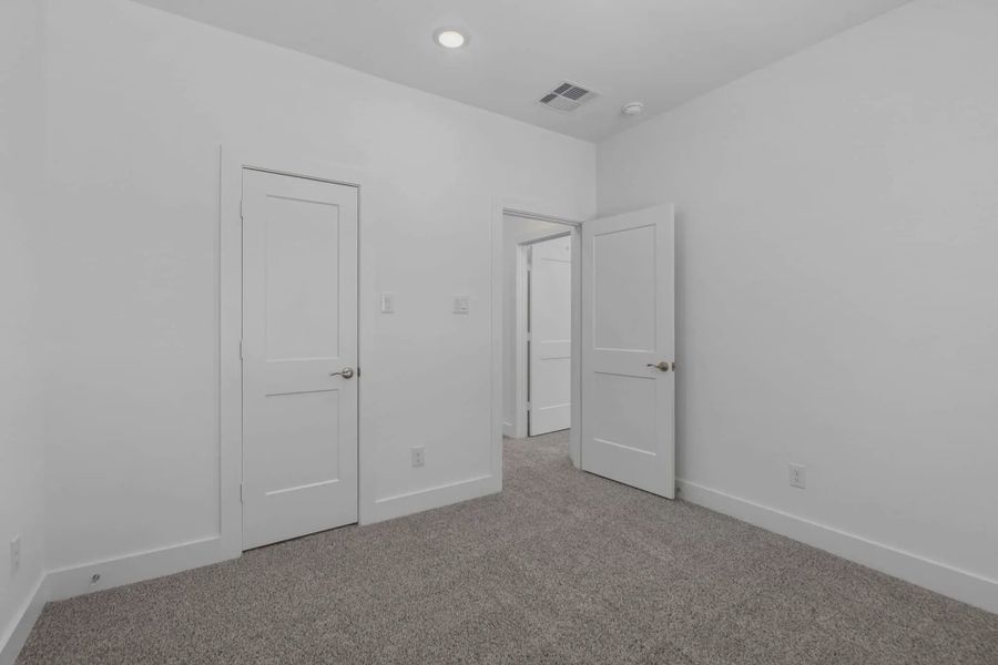Representative unfurnished interior of a home built from the Waterford by Chesmar Homes in Meridiana 60's, Manvel (Image 37).